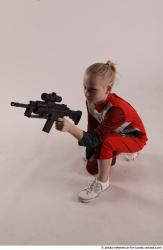 Woman Young Athletic White Fighting with gun Kneeling poses Army